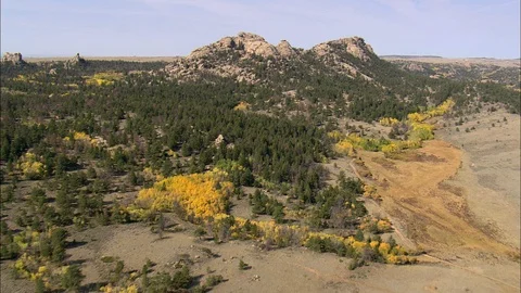 Aerial of mountain cliffs covered with forest trees, Flight Over Vedauwoo Rocks Stock Footage 109470692