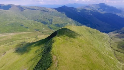 Aerial of a mountain with a cloud shade like a fallen tree in the Carpathians Stock Footage 93726958