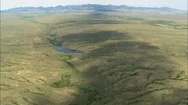 Aerial Of Mountain Landscape And Dried River Bed, River, High Up, Montana Stock Footage