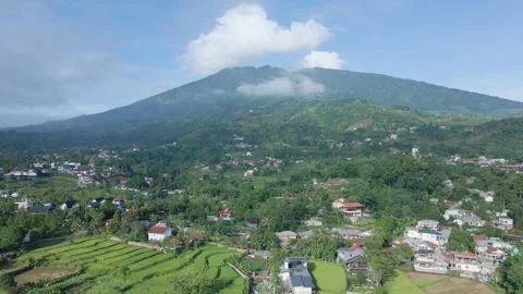Aerial Mountain Landscape with Settlement Below Stock Footage 309344342