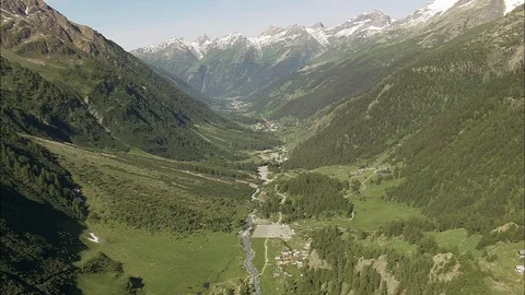 Aerial of mountain path through lush mountain ranges, Tracking Shot Down Stock Footage 108612170
