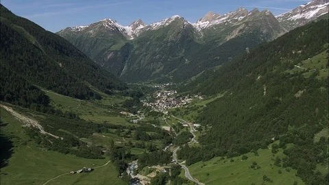 Aerial of mountain path through lush mountain ranges, Tracking Shot Down Stock Footage 108612301