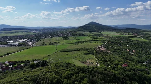 Aerial mountain paths surrounded by green forests nature lush green mountain Stock Footage 310475696