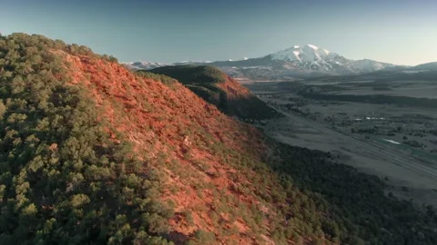 Aerial: Mountain range and Mount Sopris at sunset. Carbondale, Colorado, USA Stock Footage 161012230