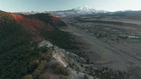 Aerial: Mountain range and Mount Sopris at sunset. Carbondale, Colorado, USA Stock Footage 161088689