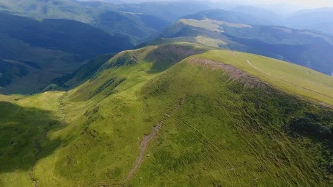Aerial of a mountain range resembling a turtle shell in the Carpathians in Stock Footage 93708847