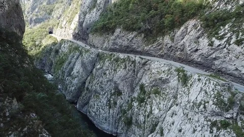 Aerial, Mountain river in canyon, аuto in the mountains goes on the road, aerial Stock Footage 80705729