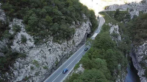 Aerial, Mountain river in canyon, аuto in the mountains goes on the road, aerial Stock Footage 80707749