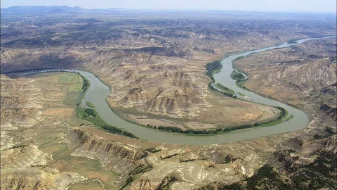 Aerial of mountain river flowing through mountain ranges, Flight Crosssing Stock Footage 109458671