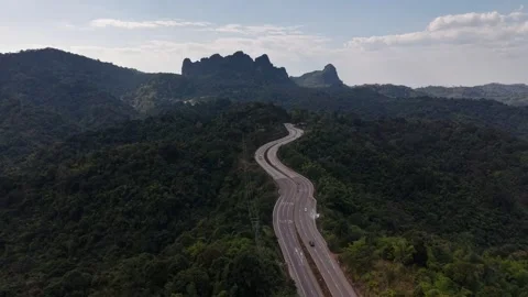 Aerial Mountain Road Through Dense Forest Stock Footage 327508221