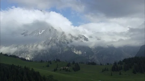 Aerial of mountain top covered with clouds, Flying Over Mountainous Area Stock Footage 108611742
