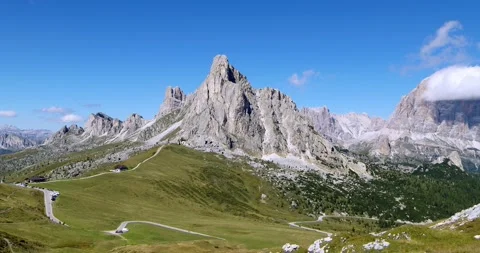 Aerial Mountain view flying down hiding Mountain and Pass Road behind Hill Stock Footage 149393965