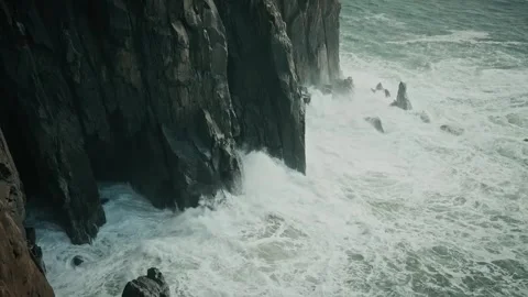 Aerial Mountain View with Powerful Waves Crashing Against Foothills Stock Footage 315099244