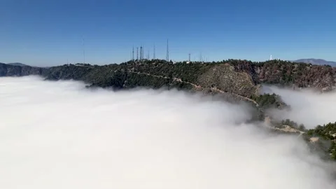 Aerial of mountains above the clouds 스톡 동영상 153052120