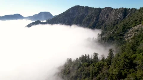 Aerial of mountains above the clouds Stock Footage 153052156