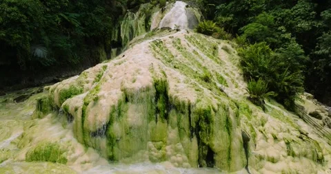 Aerial move forward view of Bilawa Mainit Hot Spring. Stock Footage 293456714
