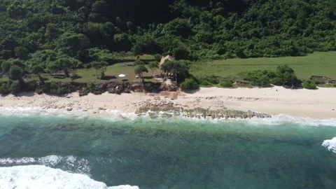 Aerial move left along central coastline, Nyang Nyang Beach Bali Stock Footage 328994374
