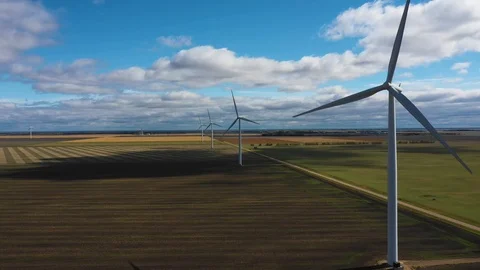 Aerial moving away from wind mill on wind farm Stockbeeldmateriaal 101000287