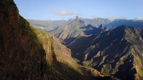 Aerial moving backward in a deep valley at sunset in Canary Islands 4K Video stock 101565078