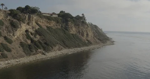 Aerial moving close to beach cliffs, drone footage Stock Footage 106637618