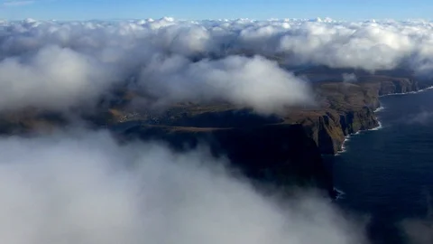 Aerial moving clouds from above sky with earth, multiple islands in background Stock Footage 92641806