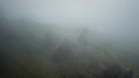 Aerial Moving Down Through Eerie Clouds Toward Fantasy-Like Rock Formation Stock-Footage 125179868