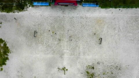 Aerial Moving Down With A Zoom-In Effect To A Rural Soccer Field With A Small Stock Footage 154566688