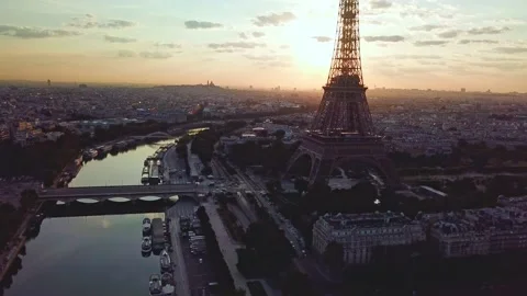 Aerial moving, facing Eiffel Tower, silhouette at sunrise. Paris skyline Stock Footage 170682034