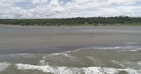 Aerial moving forwards over the waves towards the Pacific coast of Colombia Stock-Footage 79245470