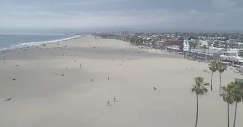Aerial moving over the big sandy beach of Venice Beach, California Video stock 76462679