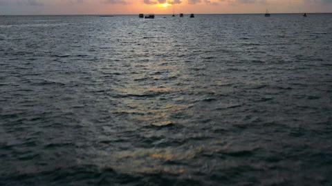 Aerial Moving Quickly Forward Over Choppy Tropical Waters With A Dramatic Tilt Video stock 154564203