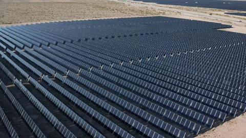 Aerial moving shot of solar panel field farm facility in Boulder City Nevada Stock Footage 271280912