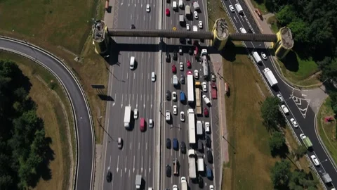 Aerial moving view of busy multilane highway with crossing Stock Footage 321370561
