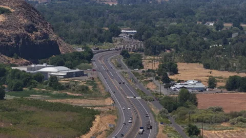 Aerial of multilane highway 12 and Naches River Bridge in Yakima Washington Stock Footage 340040545