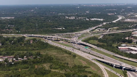 Aerial of multilevel highway interchange in southern Kansas City Missouri Stock Footage 344810827