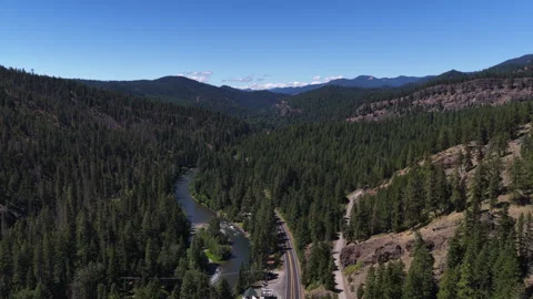 Aerial of Naches River valley through Washington forest and mountains 動画素材 339478053