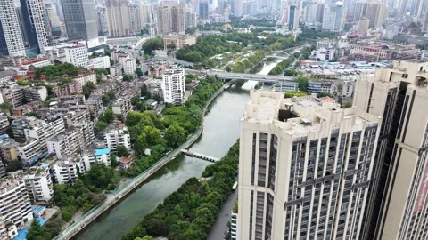 Aerial Nanming River Through Dense Urban Landscape of Guiyang Vídeos de archivo 342239001