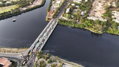 Aerial of Napier Bridge, Chennai, showing cars and buses crossing the historic Stock Footage 331553473