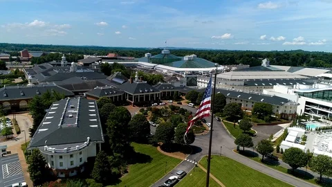 Aerial Nashville Opryland Flag Spin to Water Park with Sky Stock Footage