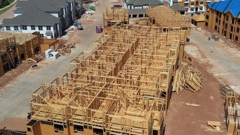 Aerial new residential commercial wood construction top view Stock Footage