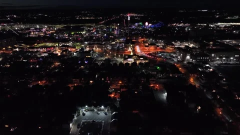 Aerial night approach to small town in winter with festive Christmas lights Stock Footage 333398474