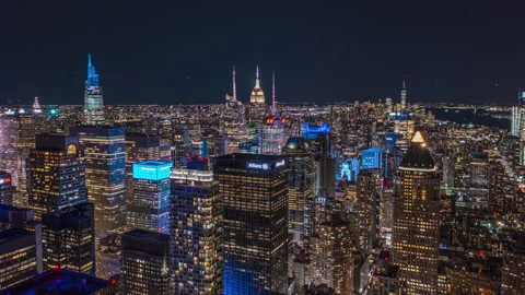 Aerial night city hyperlapse. Fly above illuminated downtown skyscrapers Stock Footage 166398565