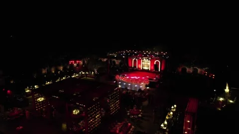 Aerial night drone view of a Big Fat Indian Wedding Venue Decoration in India Stock Footage 328814438