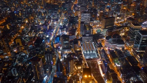 Aerial night hyper lapse over Osaka city with Umeda(Osaka) train station. Stock Footage 109101302