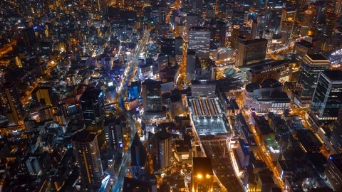 Aerial night hyper lapse over Osaka city with Umeda(Osaka) train station. Stock Footage 109101315