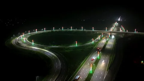Aerial night hyper lapse shot of highways in India, Vehicle running in speed on  Видео 346899007