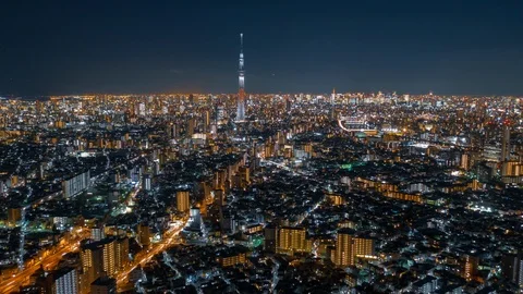 Aerial night hyper lapse of Tokyo Skytree tower with Tokyo city in background. Stock Footage 110421060