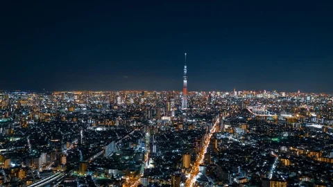 Aerial night hyper lapse of Tokyo Skytree tower with Tokyo city in background. Stock Footage 110421671