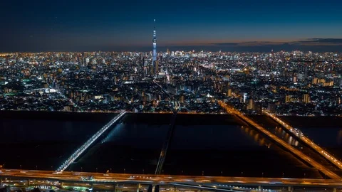 Aerial night hyper lapse of Tokyo Skytree tower with Tokyo city in background. Stock Footage 110421775