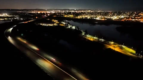 Aerial Night Hyperlapse of Busy Freeway Interchange with Traffic Light Trails Stock Footage 327098813